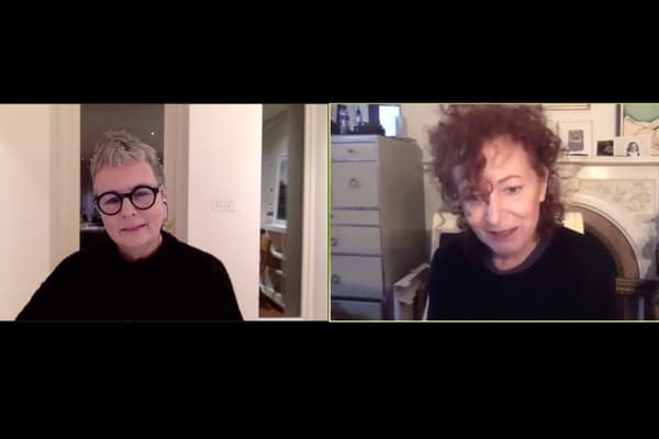 a screen capture of two women's faces on a screen, they are talking to each other over video call.