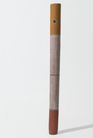 Tall ochre and yellow pole with a white herringbone design