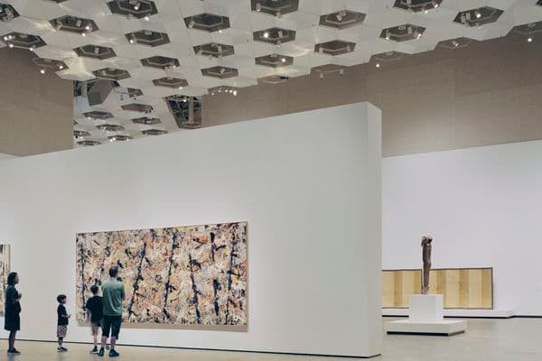 Photograph of blue poles in gallery space