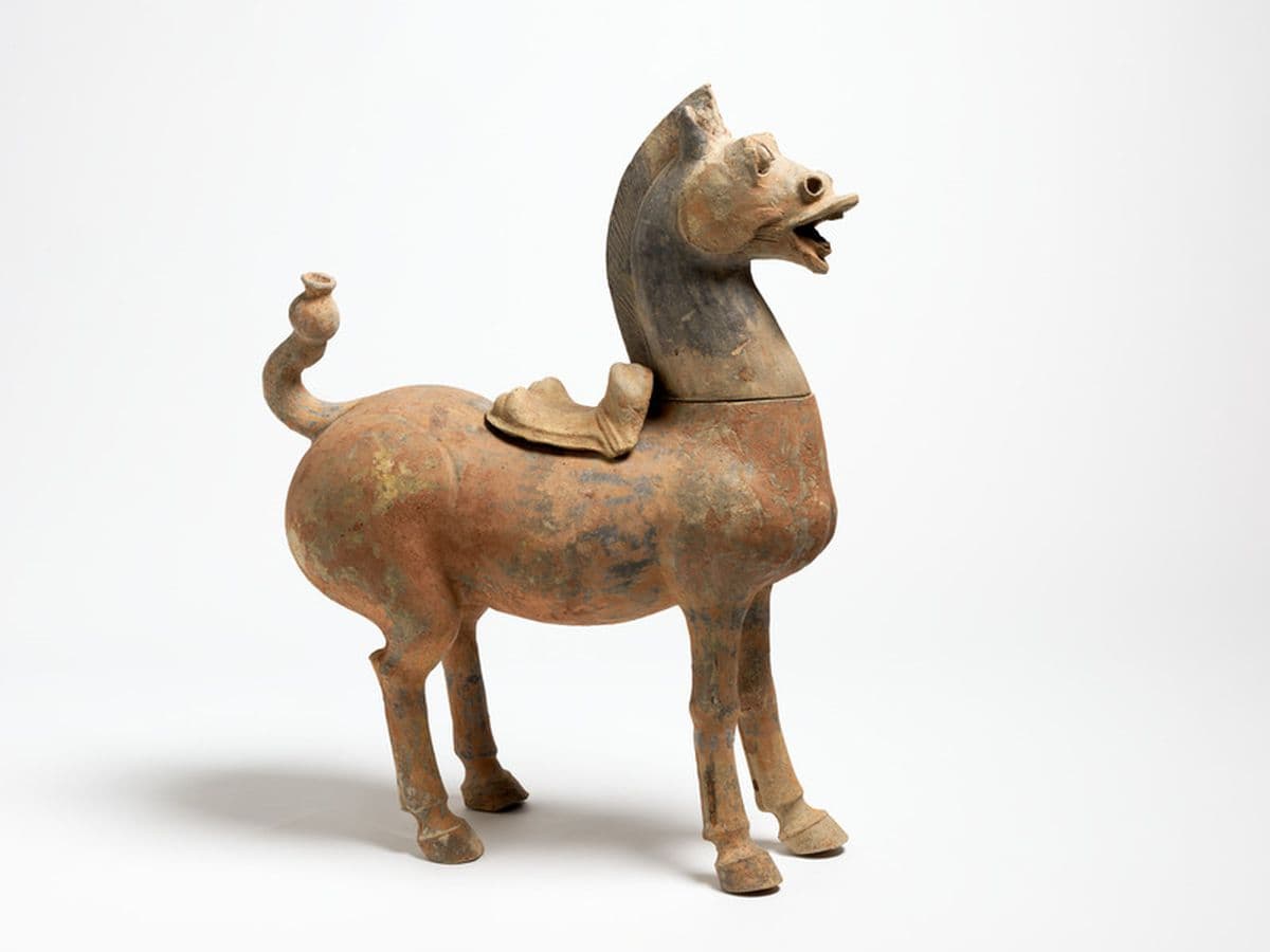 Ceramic sculpture of saddled horse