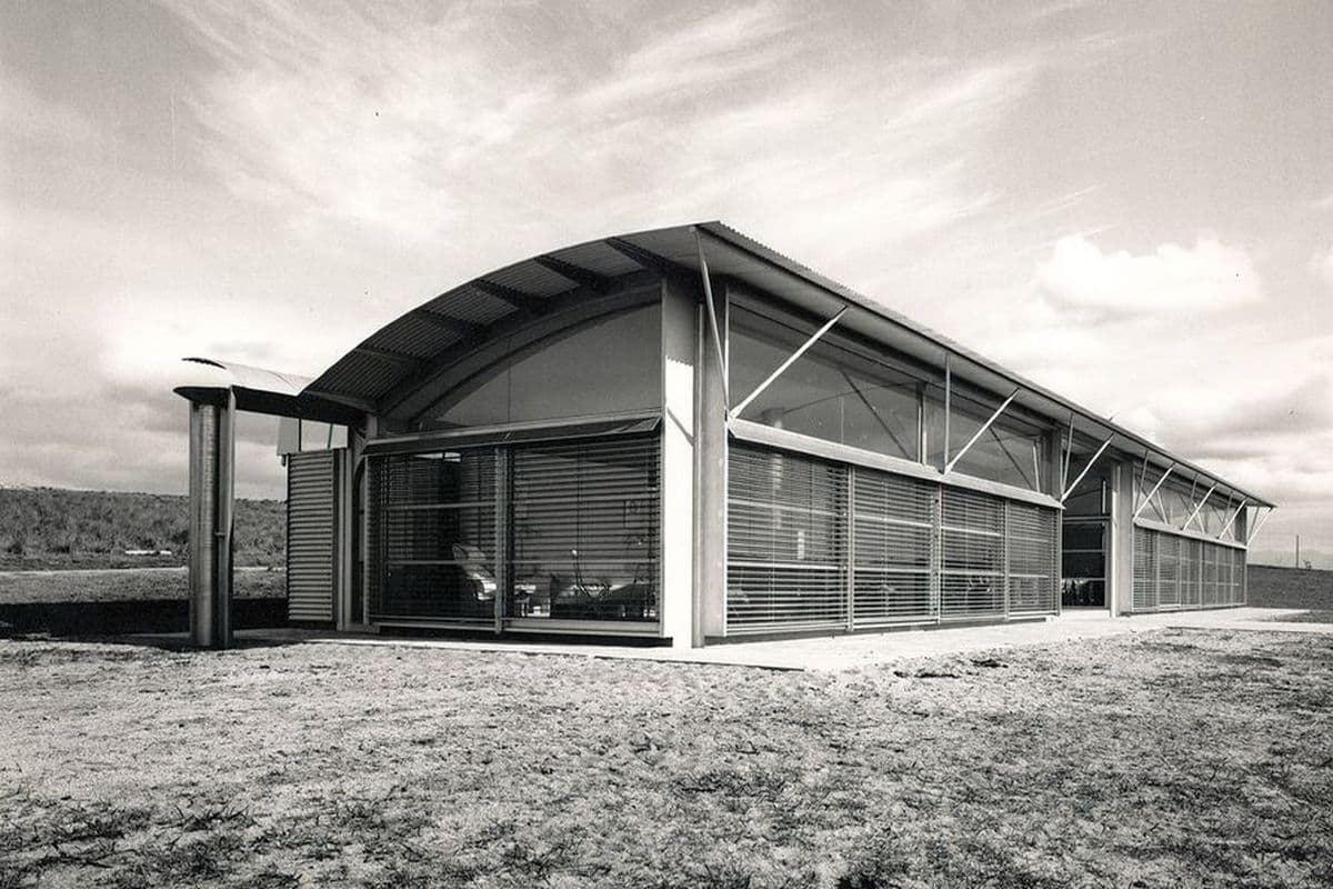 Black and white photograph of angular white building