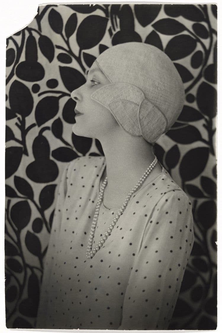 A black and white photograph portrait of a lady in a cloche