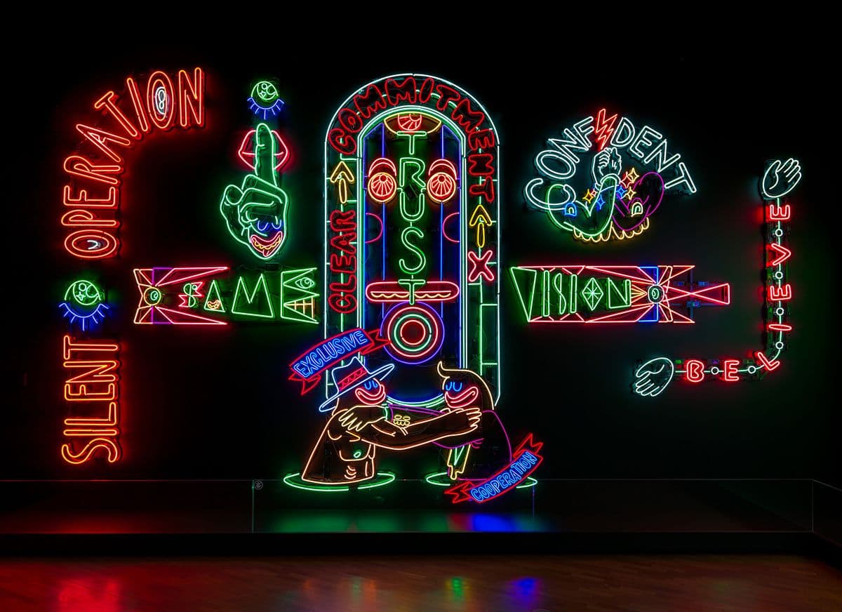 Large scale installation - black wall background with brigth multi-coloured fluorescent lights