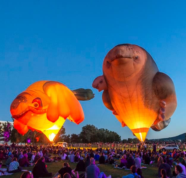 Photograph of the launch of Skywhales with people seated in foreground