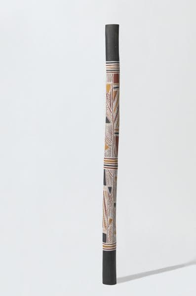 Tall, thin burial pole with traditional First Nations geometric patterning
