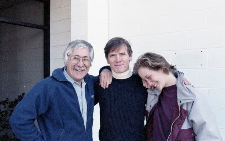 Three people standing together
