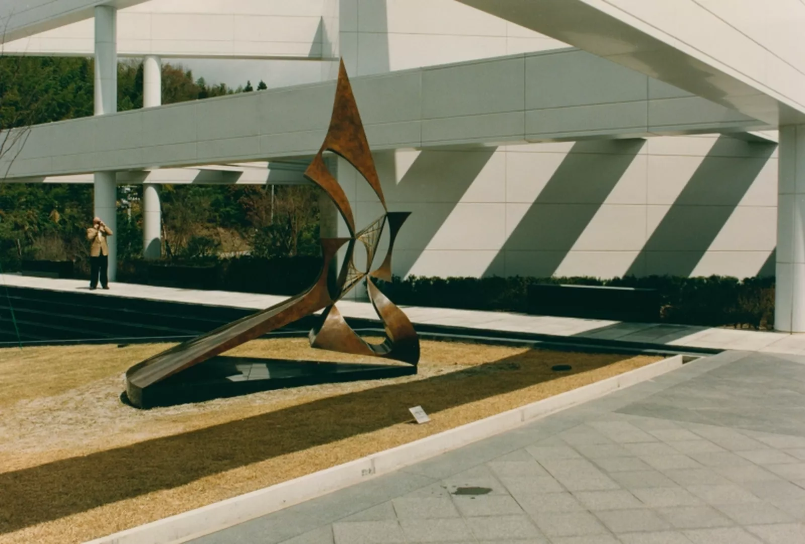 Colour photograph of abstract bronze sculpture on the lawn of the Center for Contemporary Graphic Arts