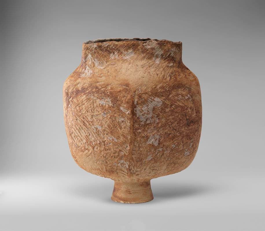Hand built light brown ceramic vessel, textured finish.