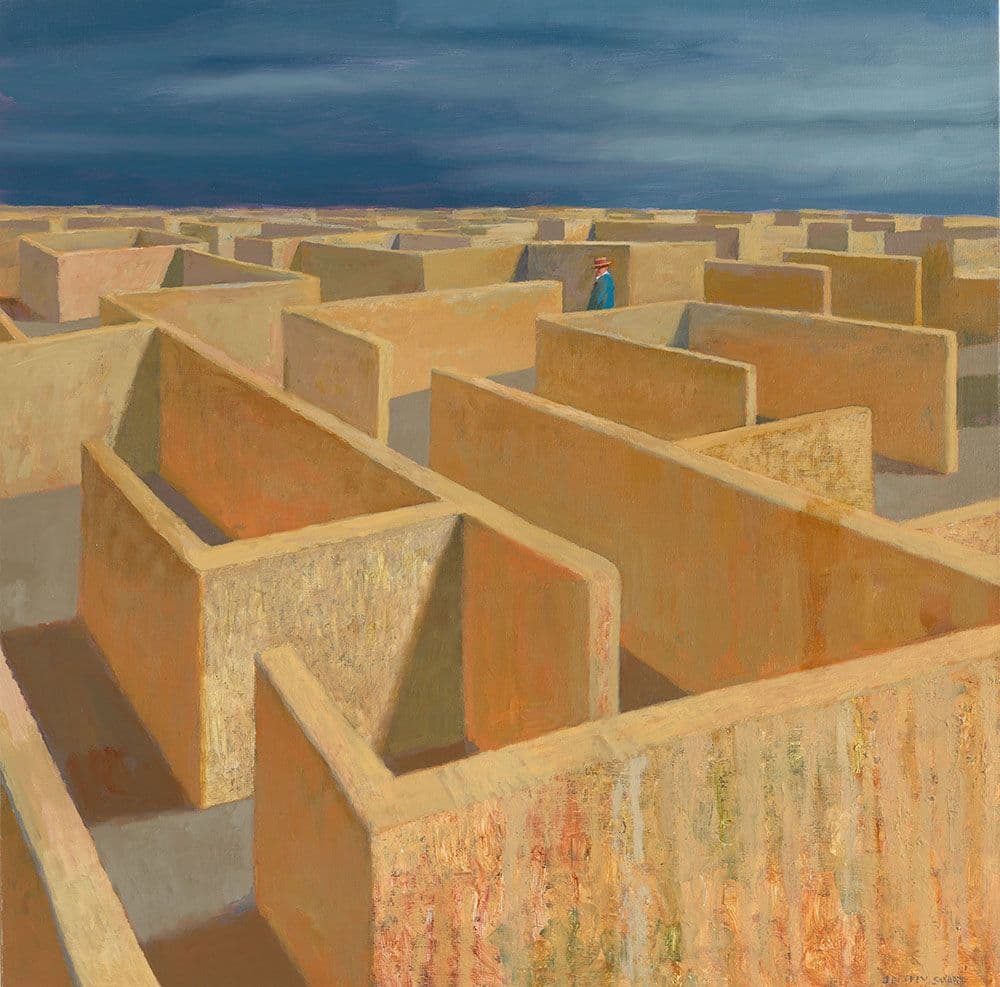 A maze of sandy walls with a figure in blue in the distance