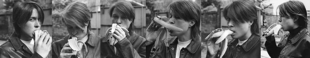 back and white photo series of artist eating banana from different angles