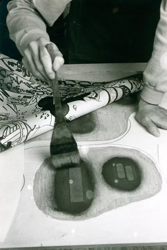 Yasuyuki Shibata moistening relief areas of carved woodblock for Masami Teraoka’s ‘Kunisada Eclipsed’ from ‘Hawaii Snorkel Series’ with a brush prior to inking