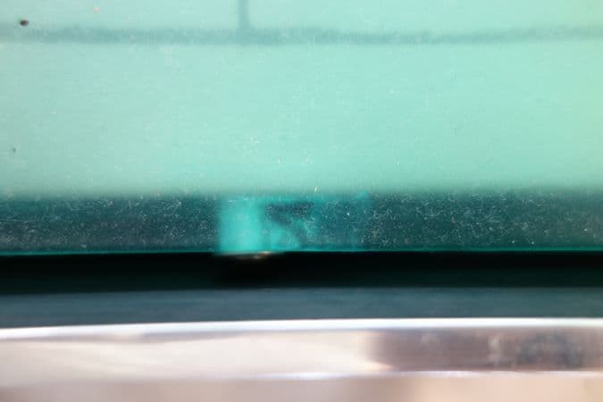 Colour photograph of dust on the polyurethane relief surface of airflow before treatment