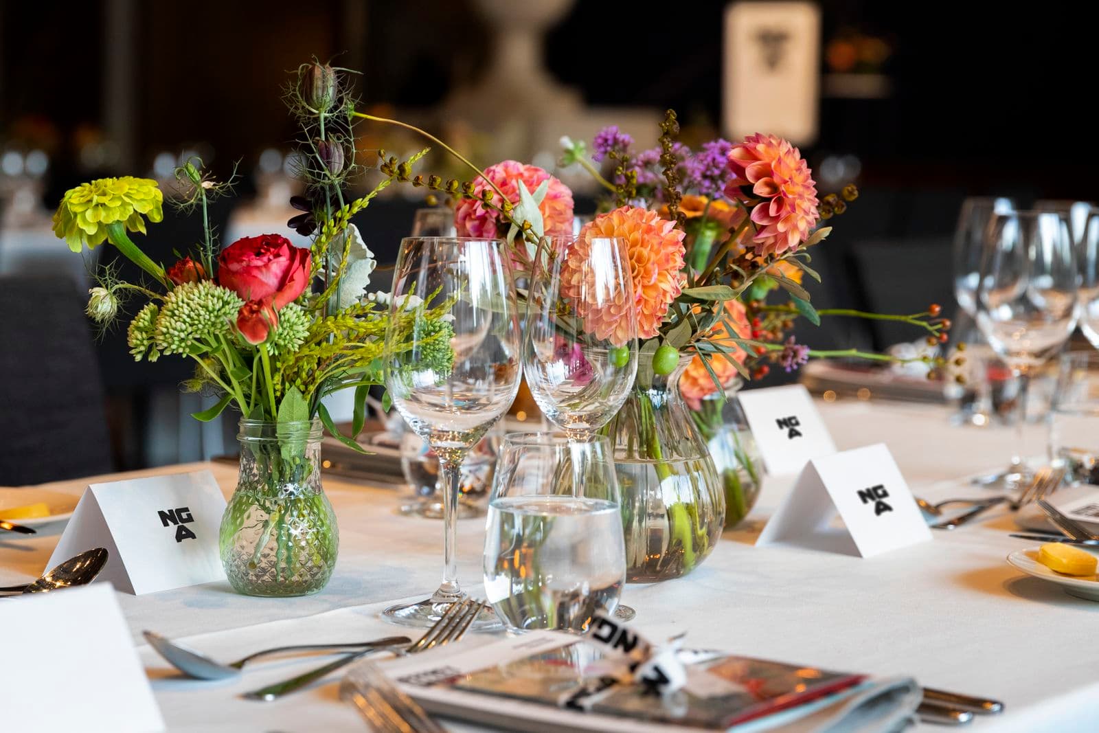 Photo of table setting with flowers and NGA logo