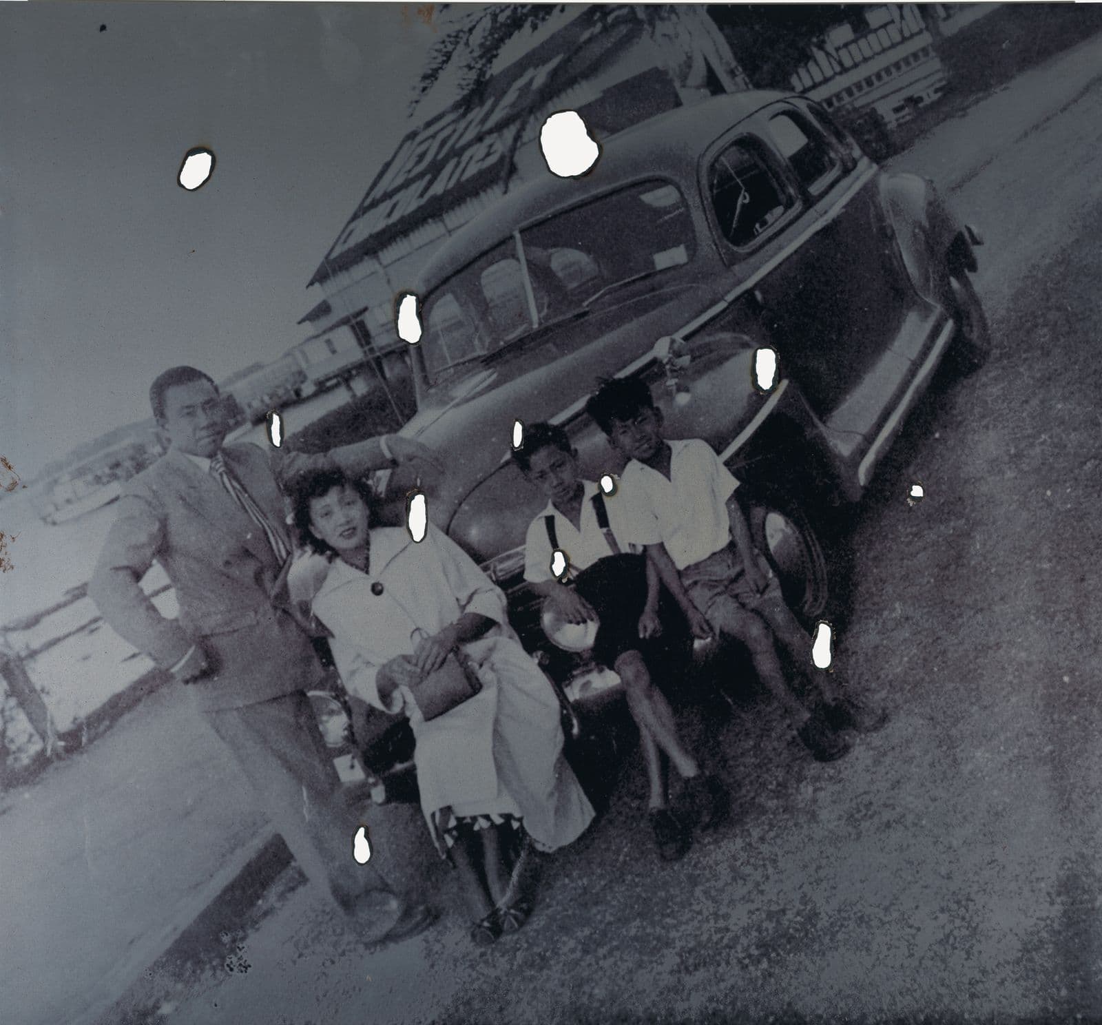 A black and white UV-cured pigment print of a photograph of an 1960s family