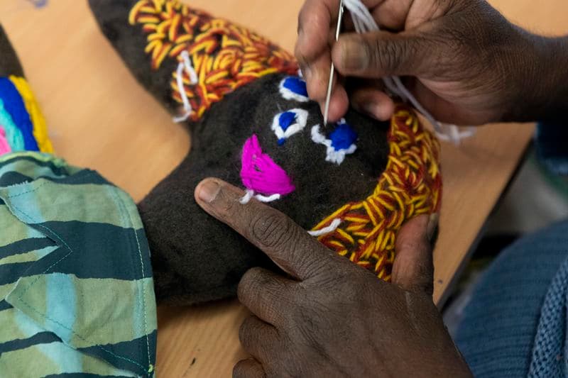 Close up image of an embroidered animal
