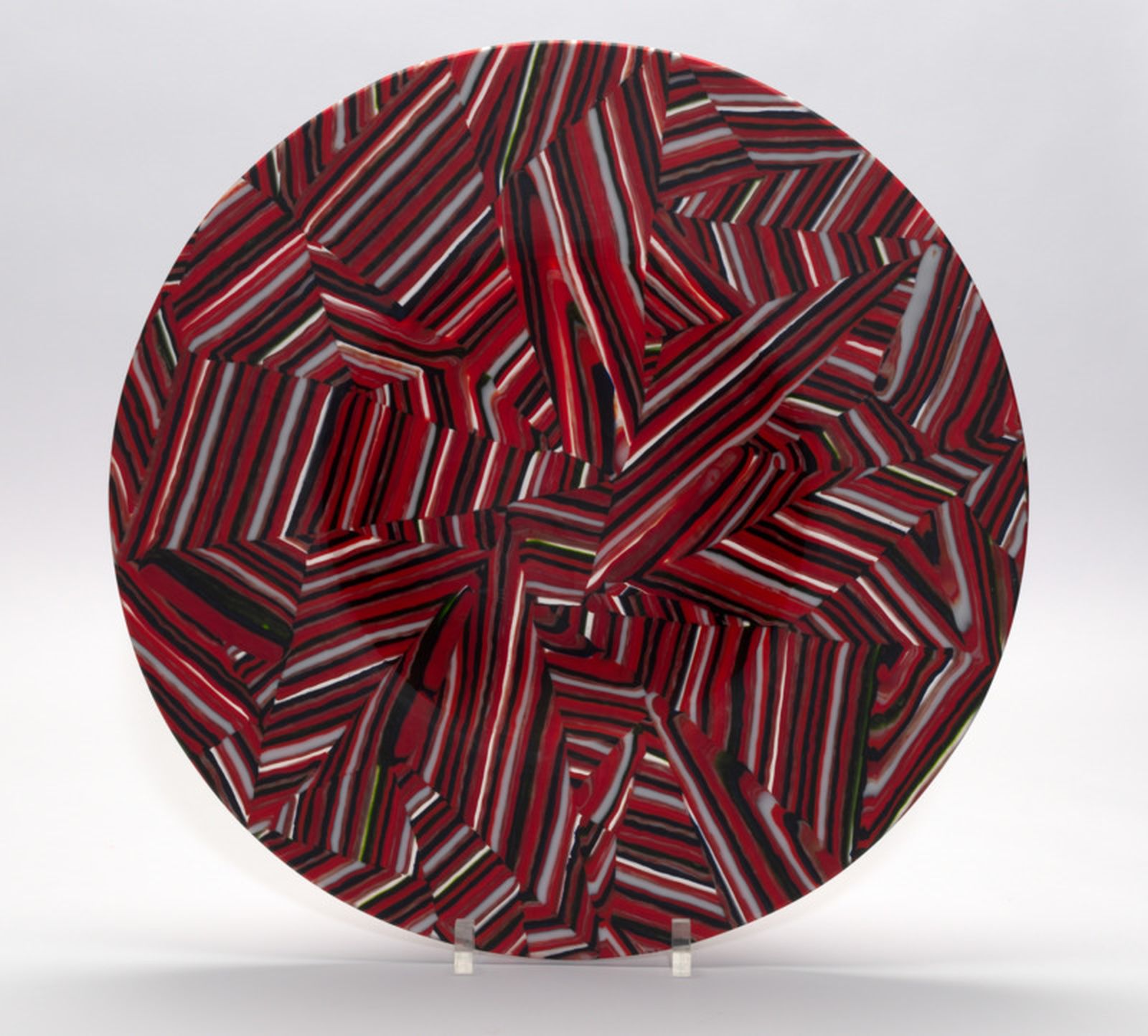 Photograph of red and black glass circular artwork