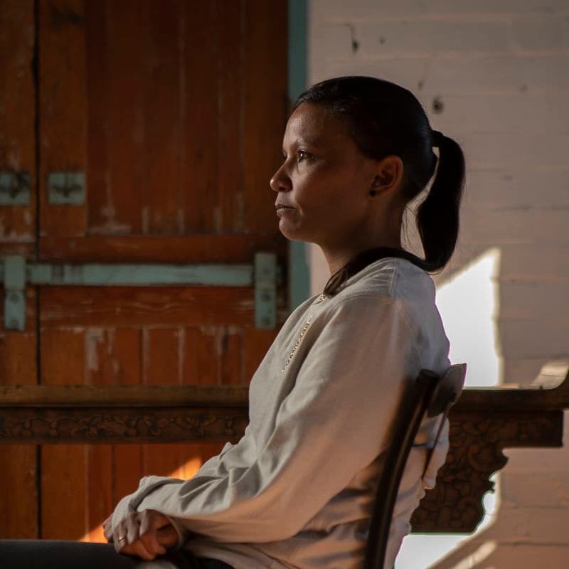 Portrait of a female sitting in a chair