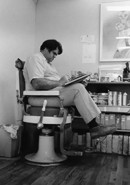 Black and White Photograph of William Crutchfield drawing in barber's chair