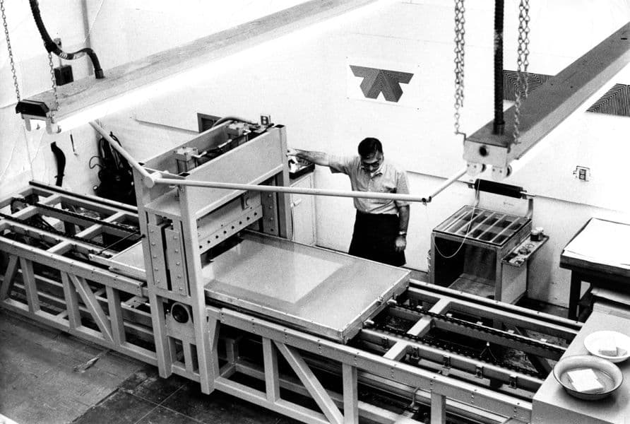 In an iconic photo, Ken Tyler contemplates his creation: A lithography press that will revolutionise printmaking for decades to come. The hydraulic system at play give the most consistent colours to the prints produced on this bed. The result will be a generation of writers exclaiming that he has achieved an 'industrial aesthetic' or a 'finish fetish' that will be associated with Los Angeles in the 1960s and 70s.