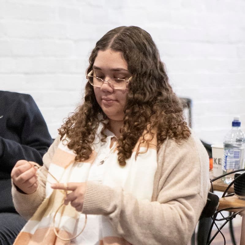 Portrait of a female sitting in a chair