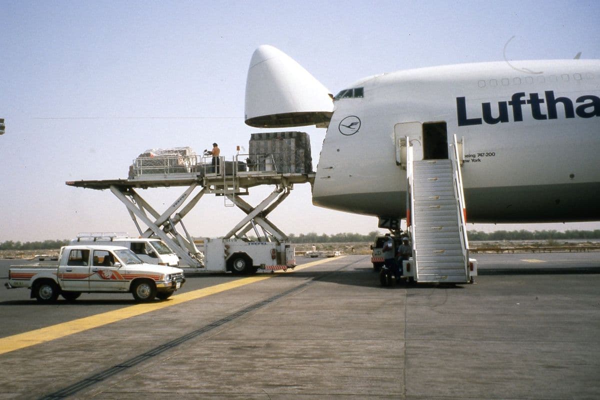 The Aboriginal Memorial touring Europe. St Petersberg. Loading cargo into the nose of plane.