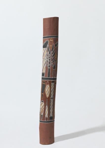 Traditional First Nations burial pole with people, trees, stone imagery