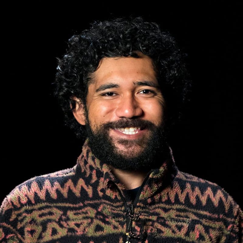 Portrait photograph of a smiling man
