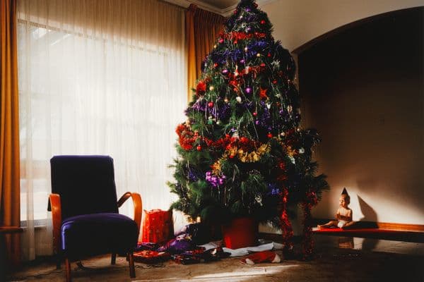 Photograph of a Christmas tree and living room furniture