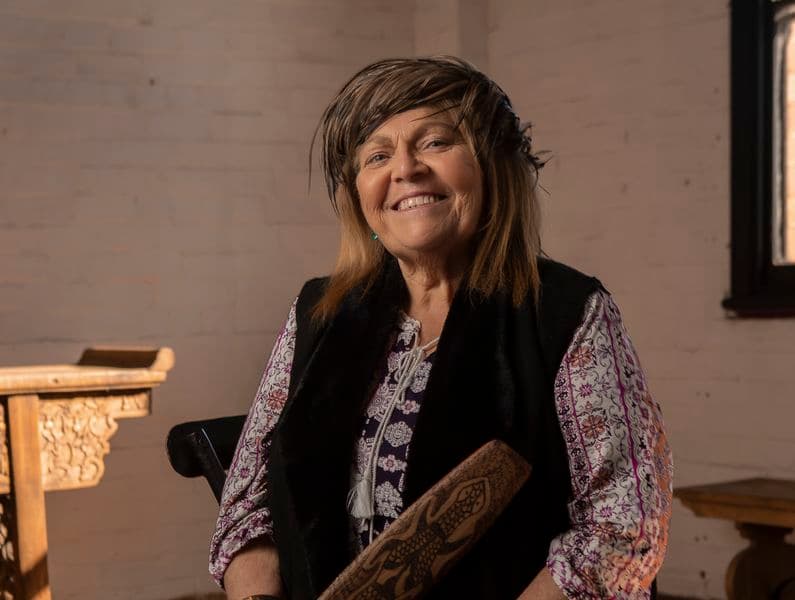 Portrait of a female sitting in a chair