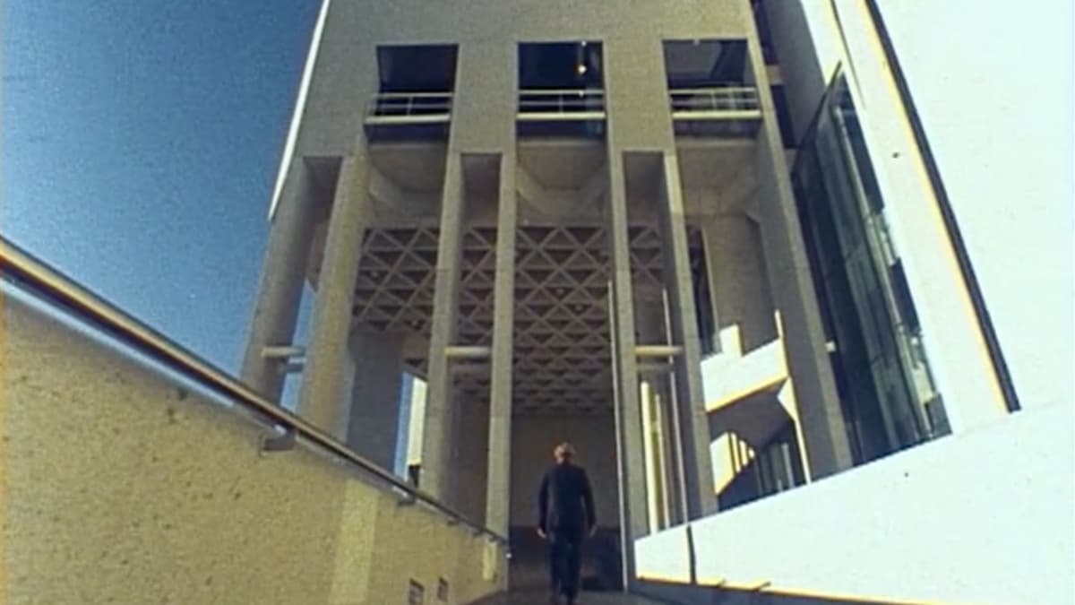 A video still of a man walking into the National Gallery of Australia