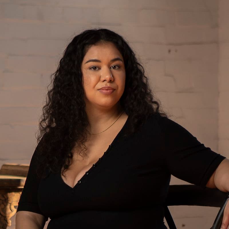 Portrait of a female sitting in a chair