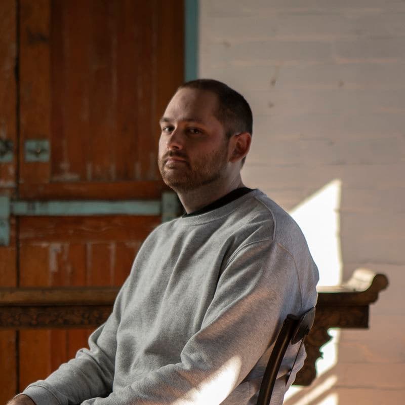 Portrait of a male sitting in a chair
