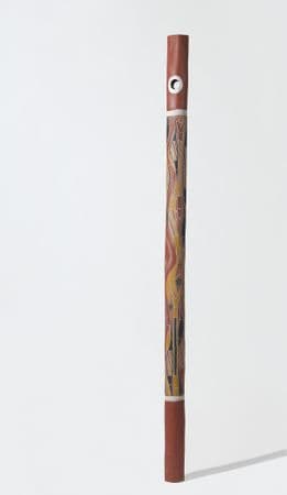 Tall and slim ochre pole with snake and fish motifs in yellow, white and black