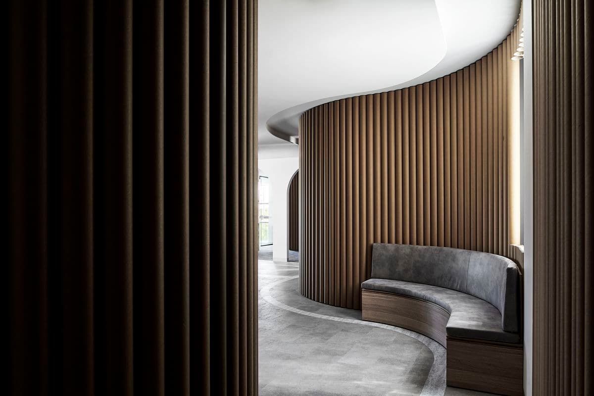 Photograph of interior with wooden curved walls