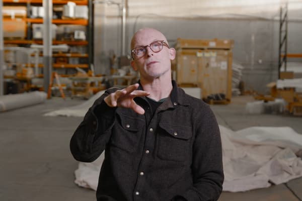 Artist Matthew Barney sitting and introducing his film
