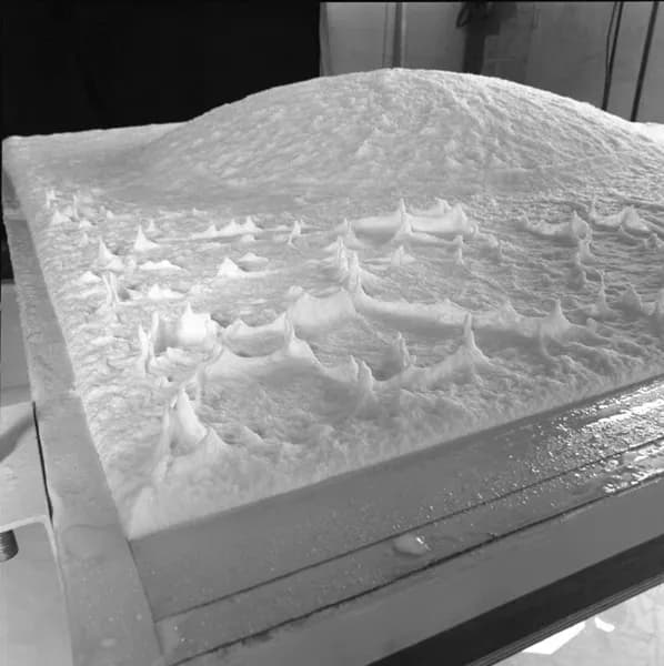Black and white photo showing newly vacuum formed paper pulp sheet