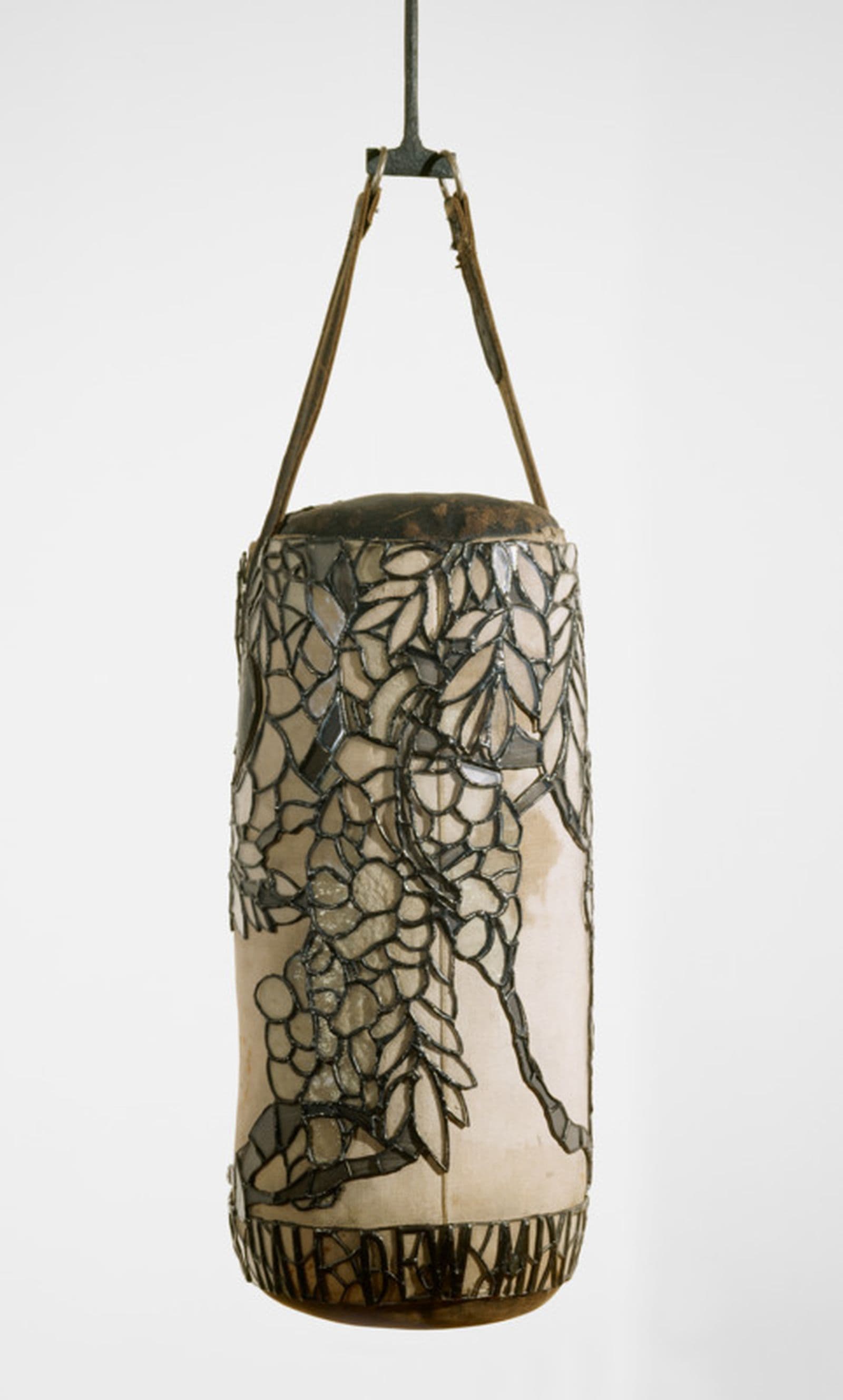 A punching bag with floral lead filigree