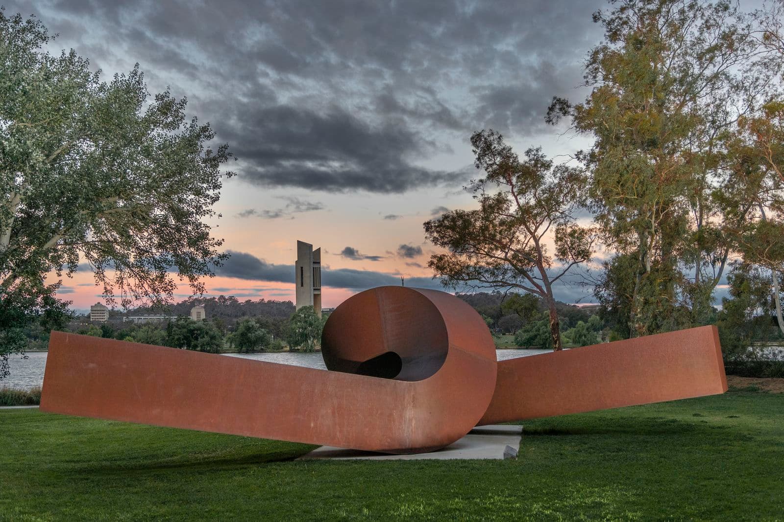 Photograph of sculpture garden with Virginia by Clement Meadmore in foreground and lake in background