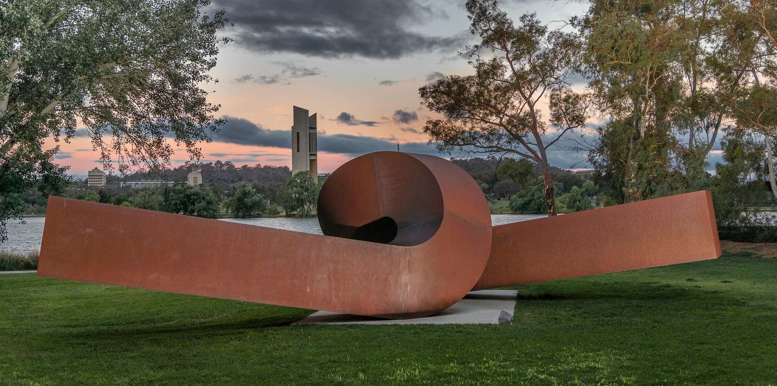 A colour photo of a copper coloured looped sculpture