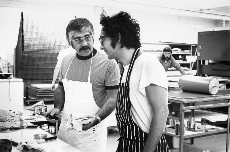 Master printer Kenneth Tyler (wearing big ol' glasses) and the artist Frank Stella (sporting a dashing hairstyle) in discussion as Tyler mixes ink for Stella’s ‘Newfoundland’ series, Gemini G.E.L., Los Angeles, California, 1970. An unidentified onlooker glares with the intensity of a thousand suns (we suspect he is an employee)