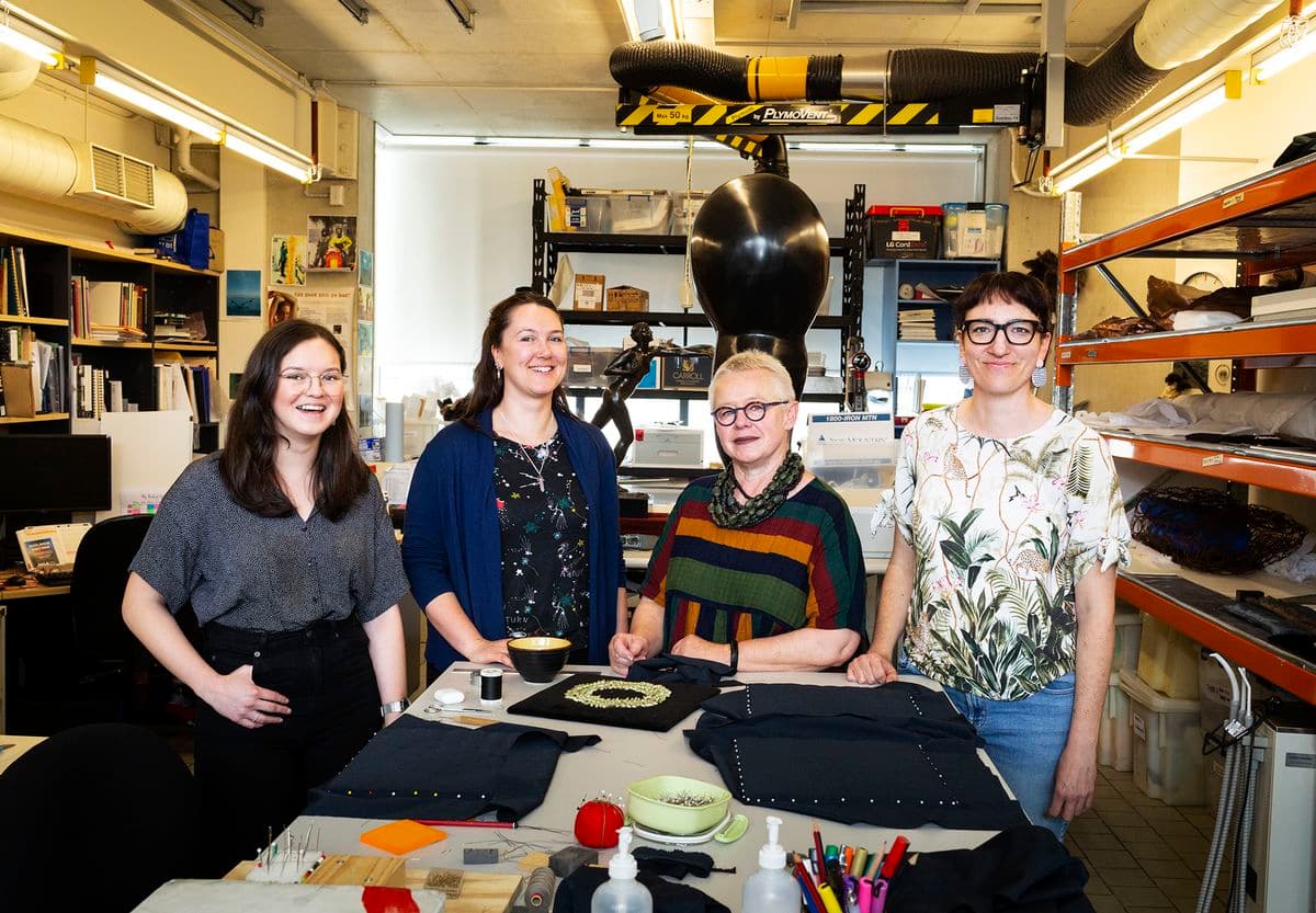A team of conservators in the conservation lab