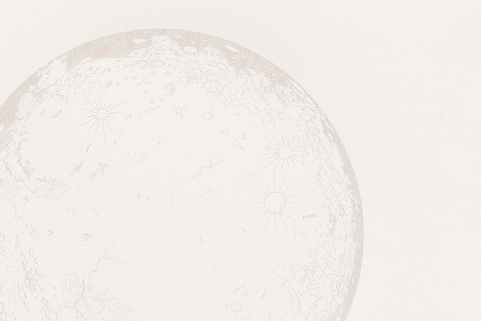 A close up picture of a moon created with pin pricks on paper