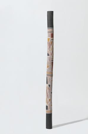 Tall, thin burial pole with traditional First Nations geometric patterning