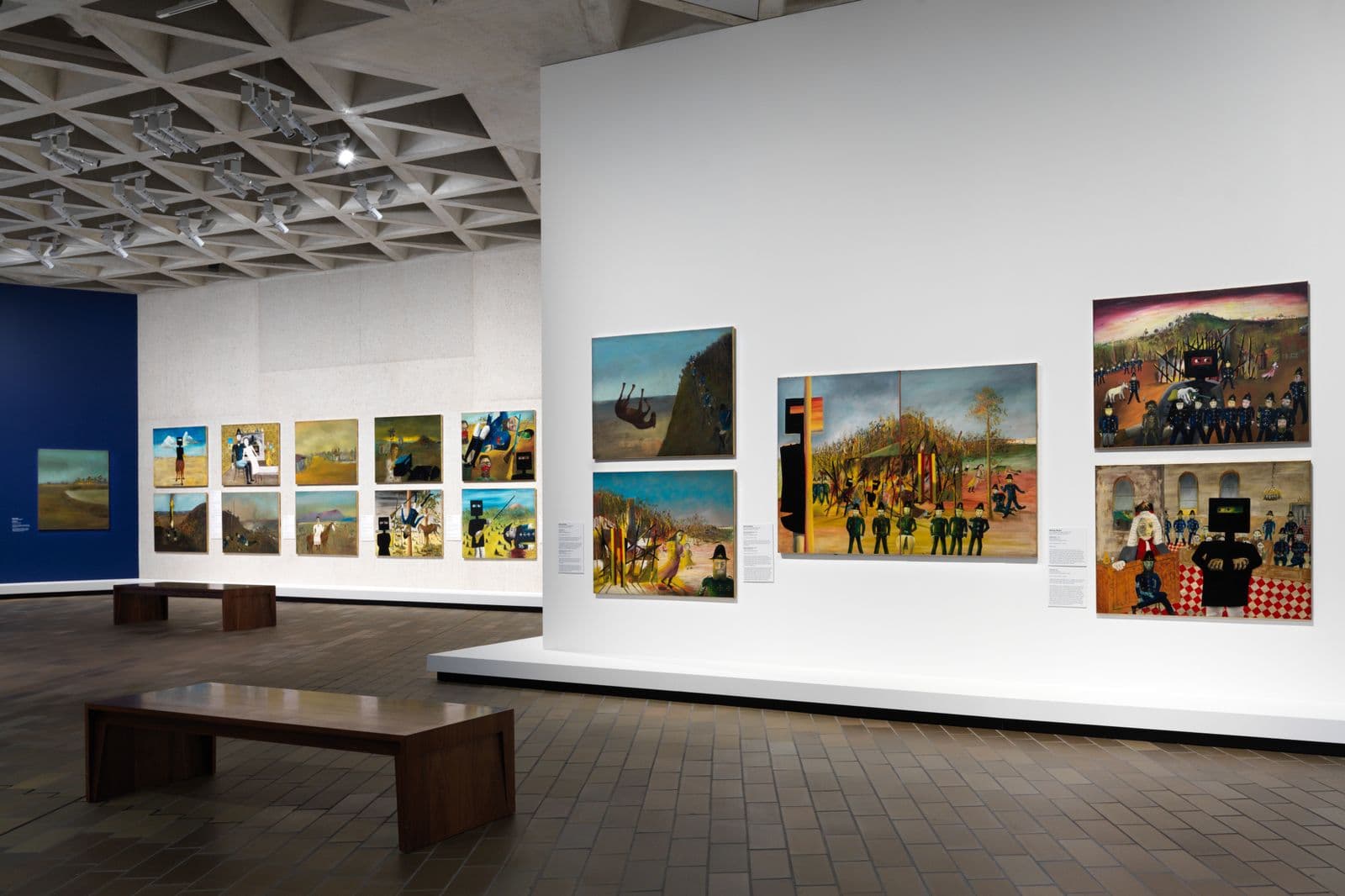 Paintings of Ned Kelly by the artist Sidney nolan hang on the brutalist architecture of the National Gallery of Australia.