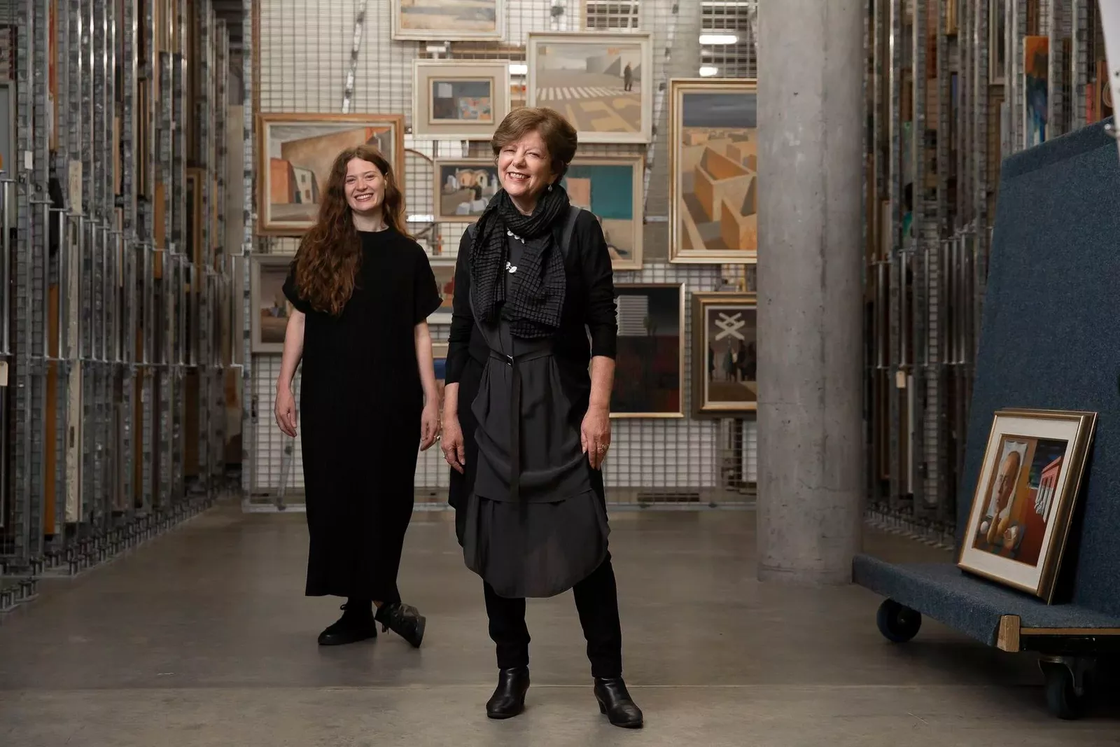 Photo of curators Dr Deborah Hart and Dr Rebecca Edwards among the artworks presented in the exhibition.