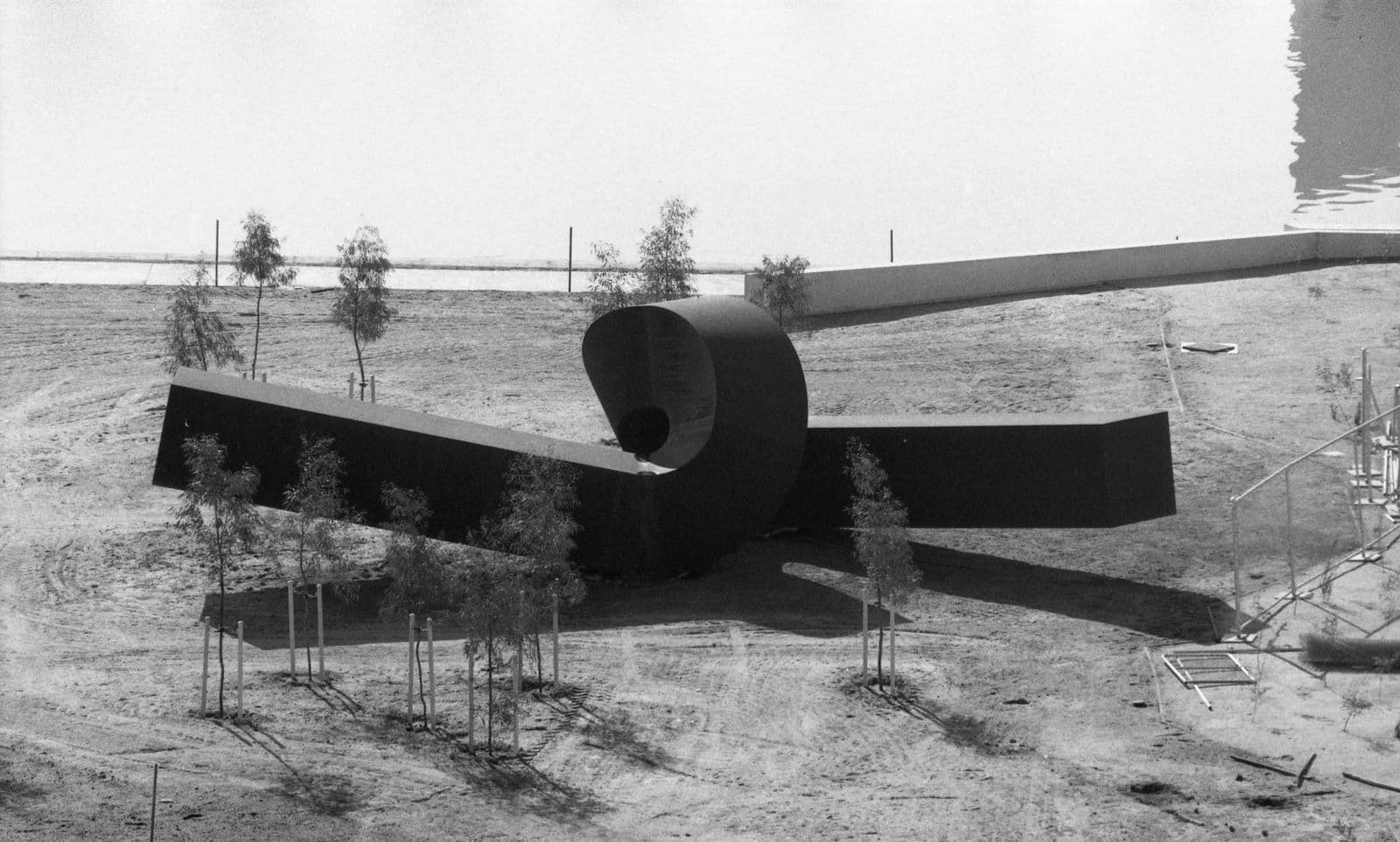 A black and white photo of a looping sculpture