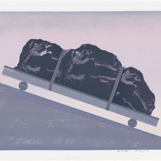 A print of a dark, rock-like object strapped to a board on wheels going down an declined hill