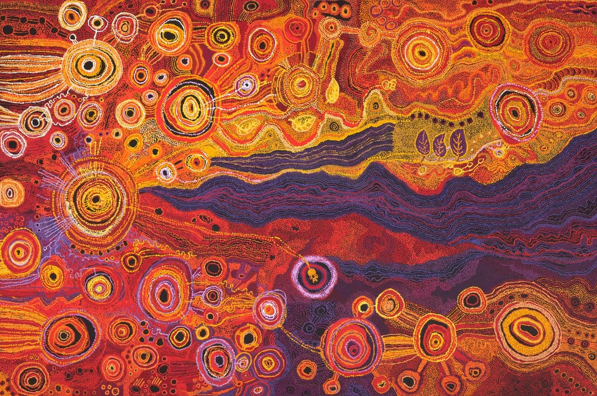 a large dot painting in bright colours