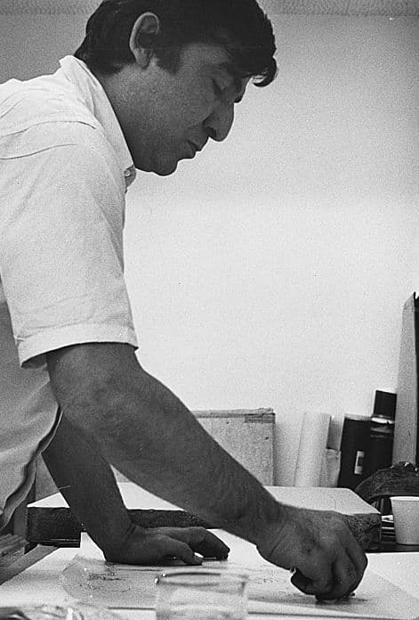 Black and white photograph of John Altoon working in his studio