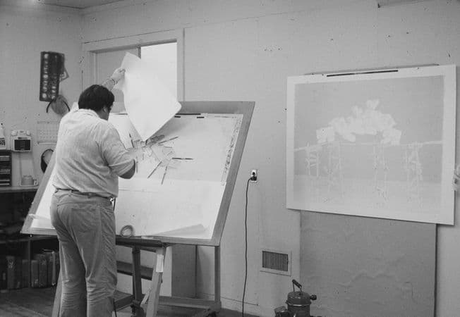 William Crutchfield spraying liquid tusche with an air brush for 'Trestle trains'